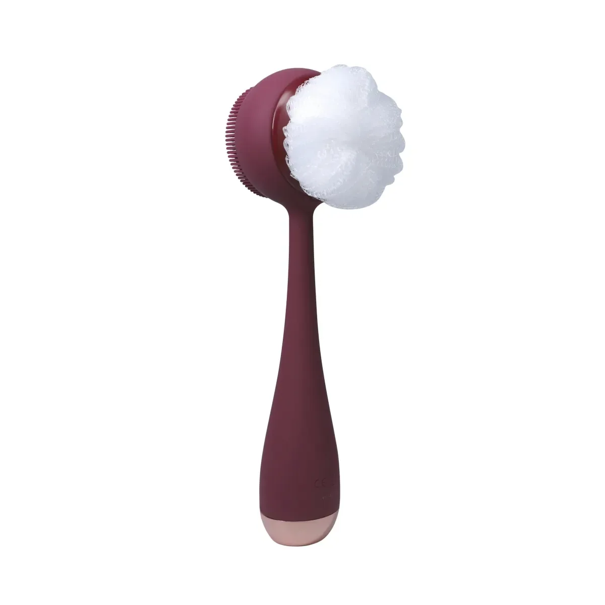 PMD Corps Propre – avis : appareil bordeaux à tête de brosse en silicone et fleur de bain blanche sur fond blanc
