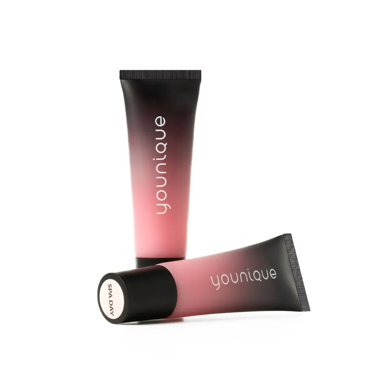 YOUNIQUE BARE·YOU lip balm : Spa Day shade: upright and lying tubes fading from black to pink, cap labelled Spa Day, on a white background