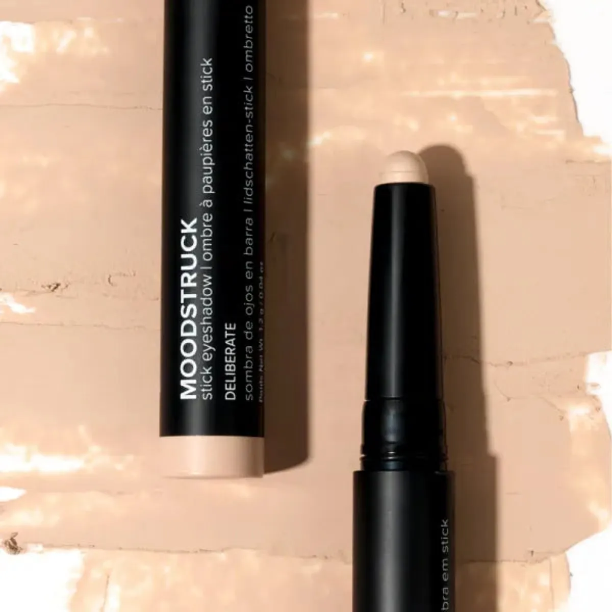 Younique MOODSTRUCK eyeshadow stick in Deliberate, a matte peach nude shade: stick and colour swatch