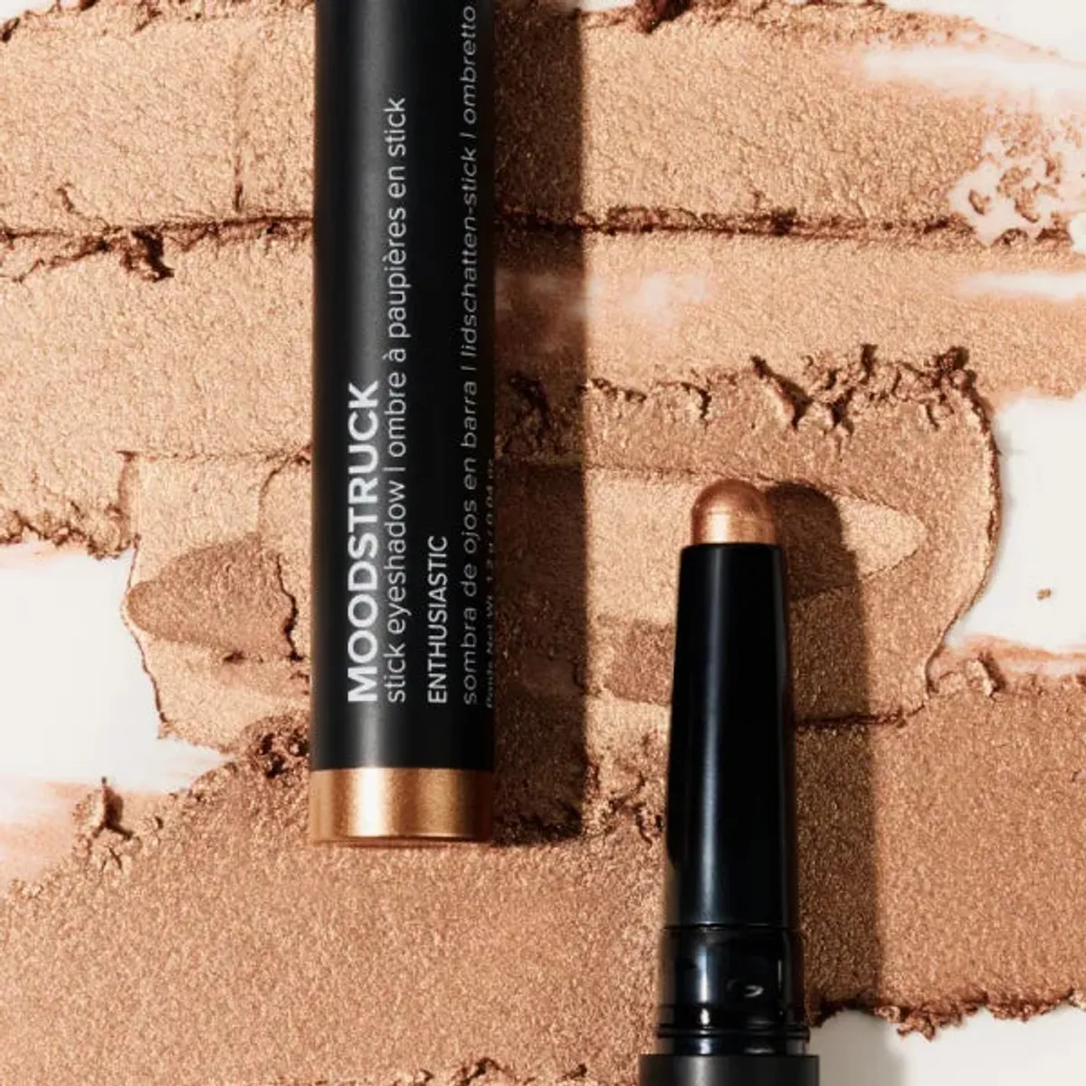 Younique MOODSTRUCK eyeshadow stick in Enthusiastic, a shimmer golden bronze shade: stick and colour swatch