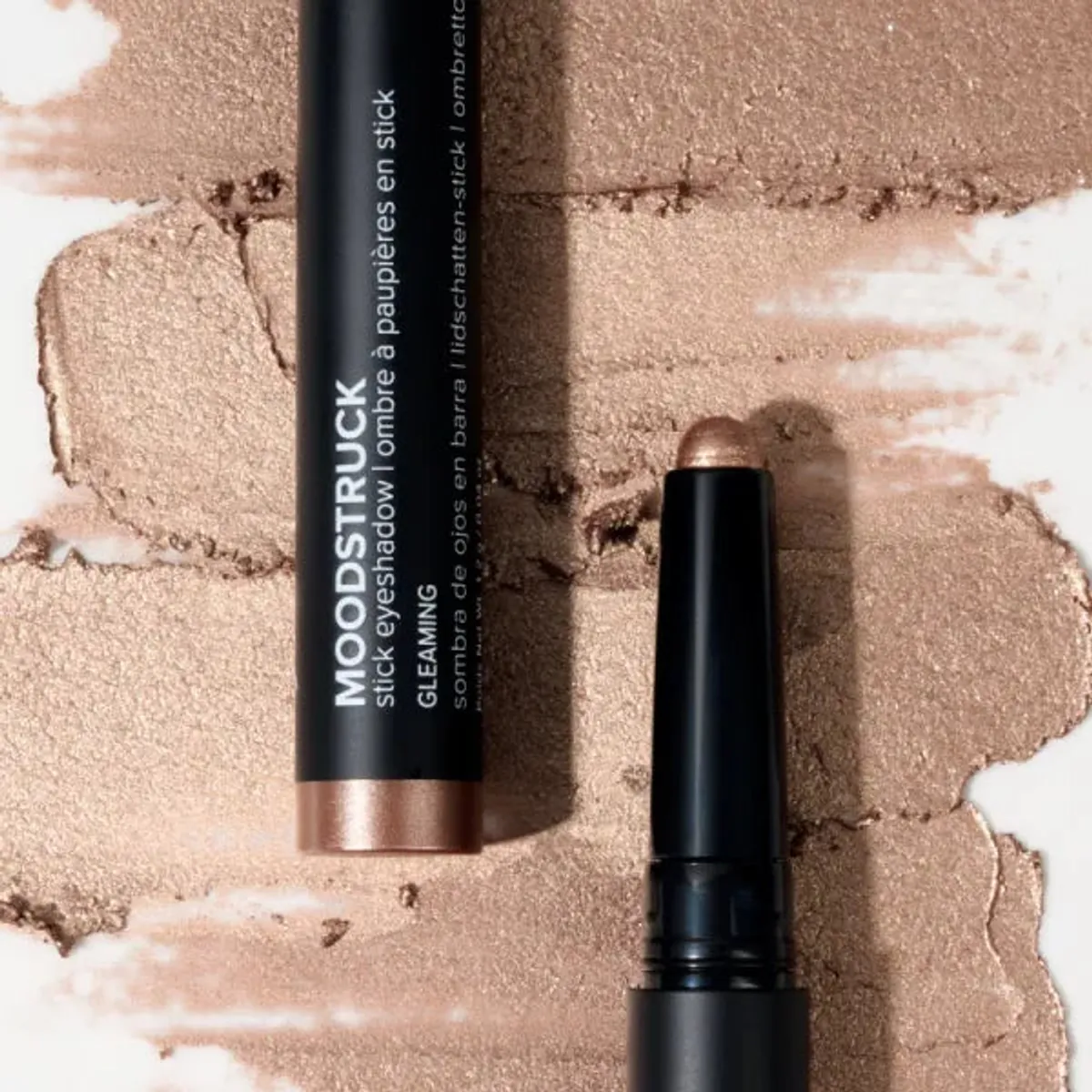 Younique MOODSTRUCK eyeshadow stick in Gleaming, a shimmer copper rose shade: stick and colour swatch