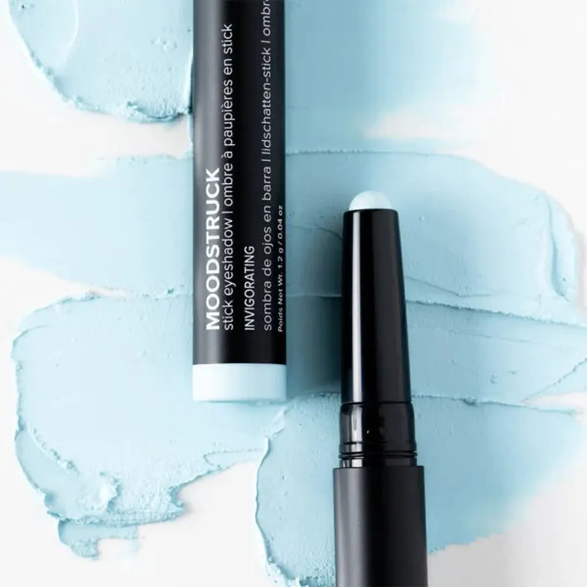 Younique MOODSTRUCK eyeshadow stick in Invigorating, a matte pastel sky blue shade: stick and colour swatch