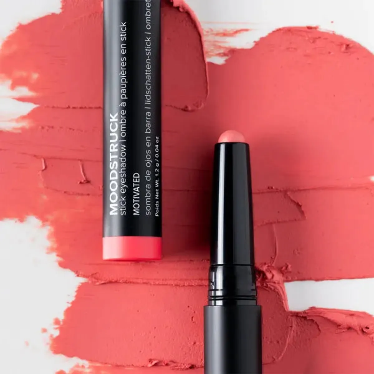 Younique MOODSTRUCK eyeshadow stick in Motivated, a matte pink coral shade: stick and colour swatch
