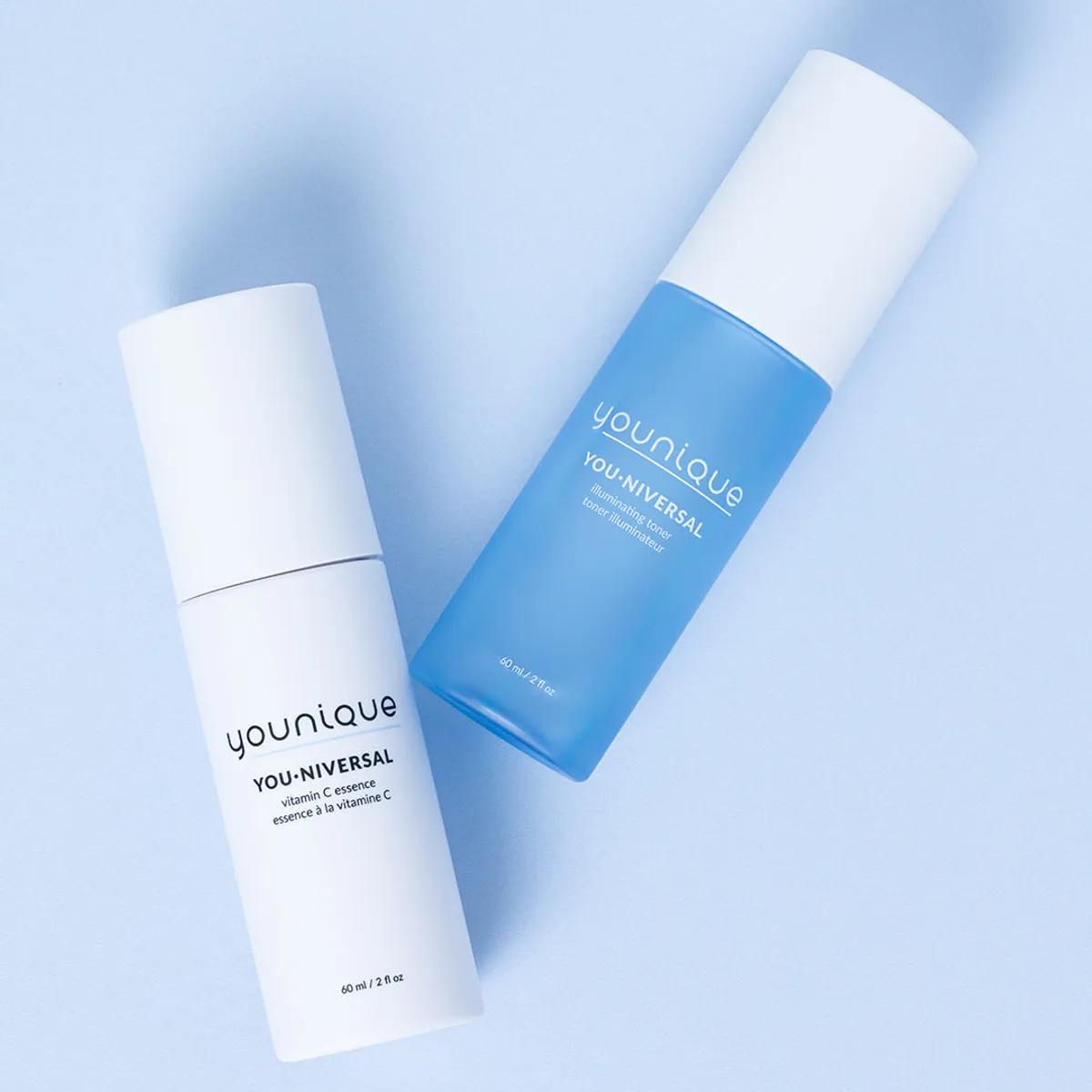YOUNIQUE YOU·NIVERSAL illuminating toner – bottle next to the white vitamin C essence bottle
